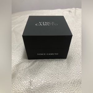 I am selling a Vince Camuto Watch, Size fits all, Colorway is dark tan and grey.